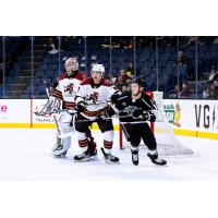 Tucson Roadrunners defend against the Ontario Reign